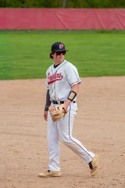 Infielder in the ready position on the dirt