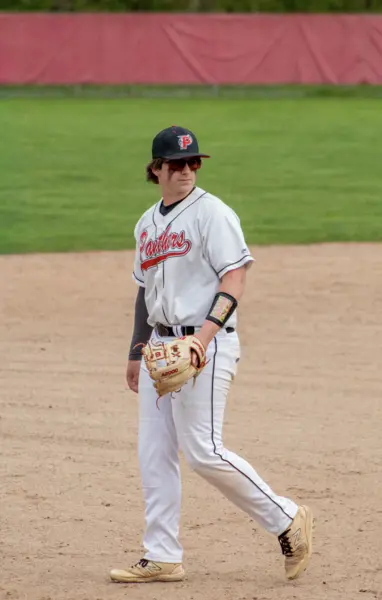 Infielder walking back to position on the dirt