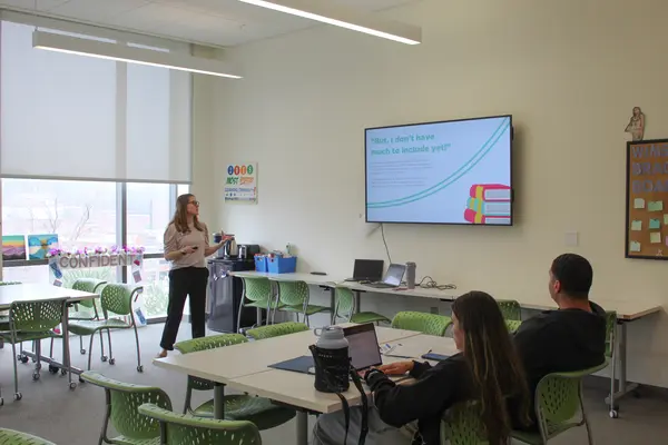 Speaker addressing students during a resume workshop presentation