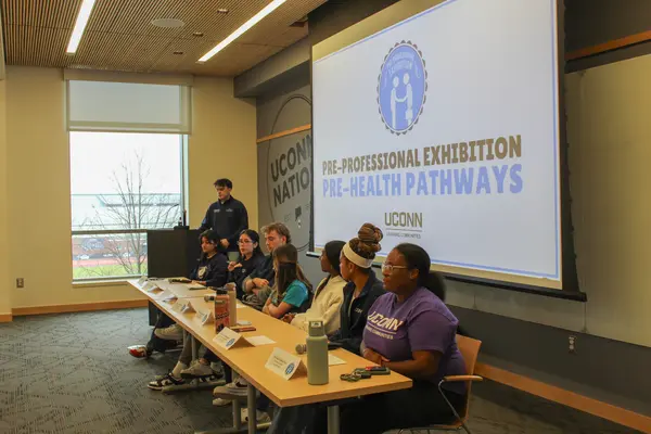 Panelists seated at a table for the Pre-Health Pathways panel