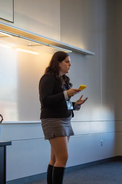 Delegate speaking and gesturing while addressing the room