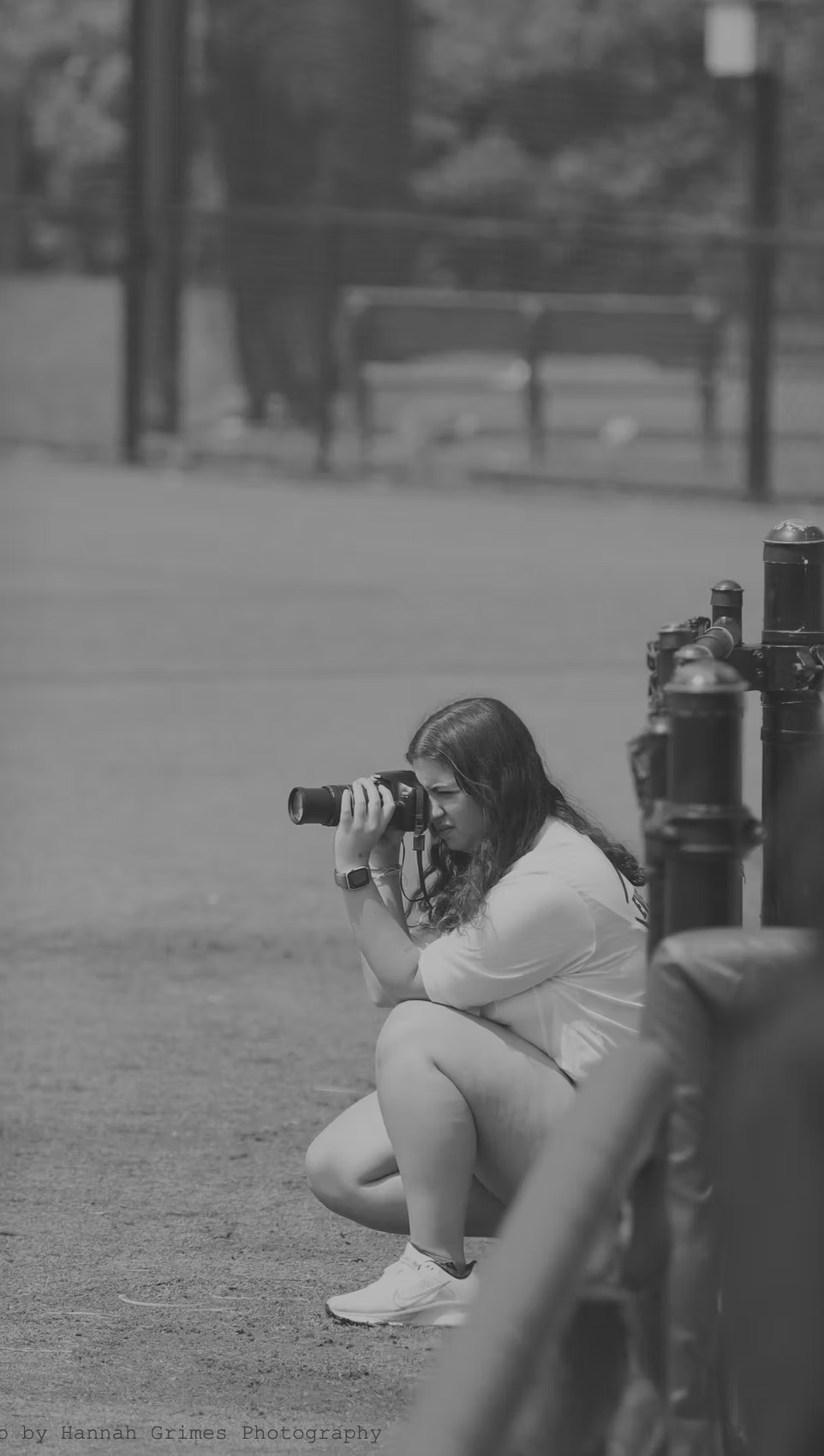 Hannah Brocksmith photographing a baseball game